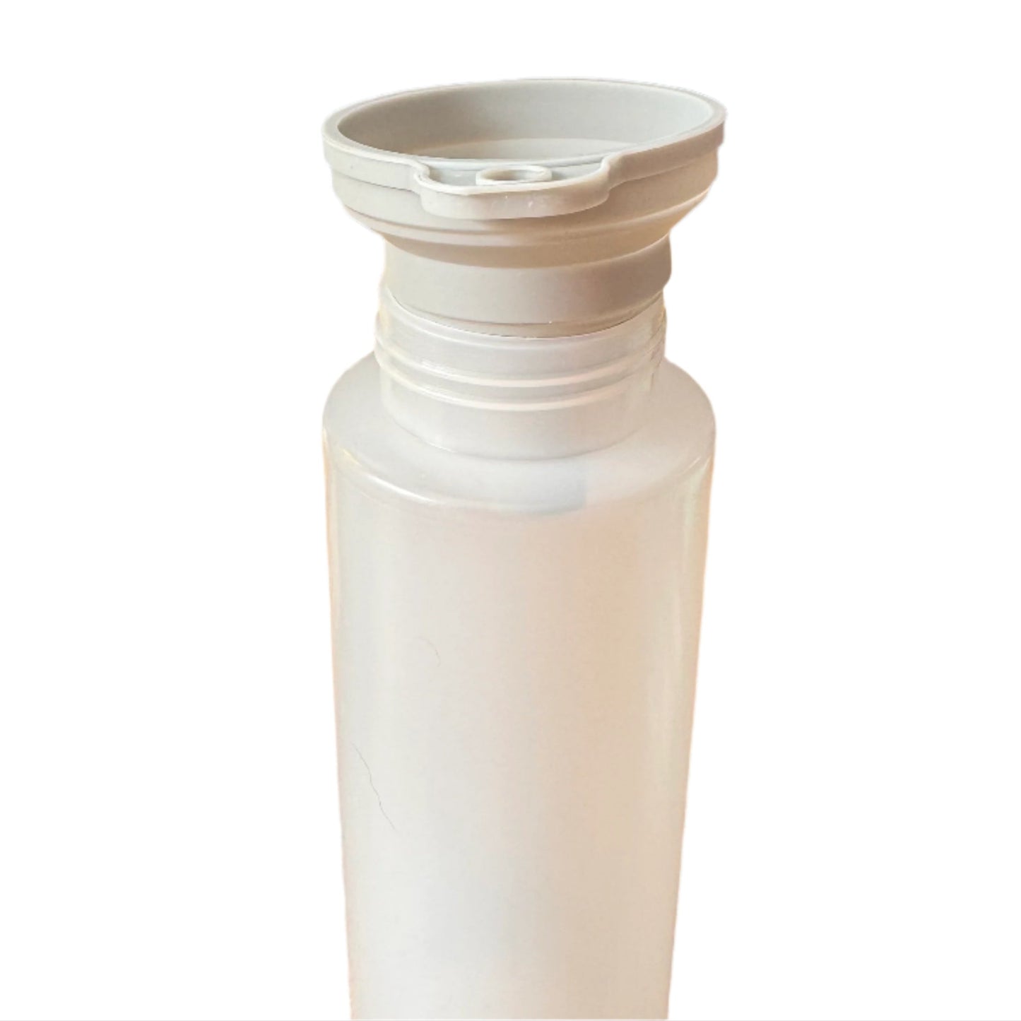 White collapsible water bottle on a wooden table with a blue wall in the background