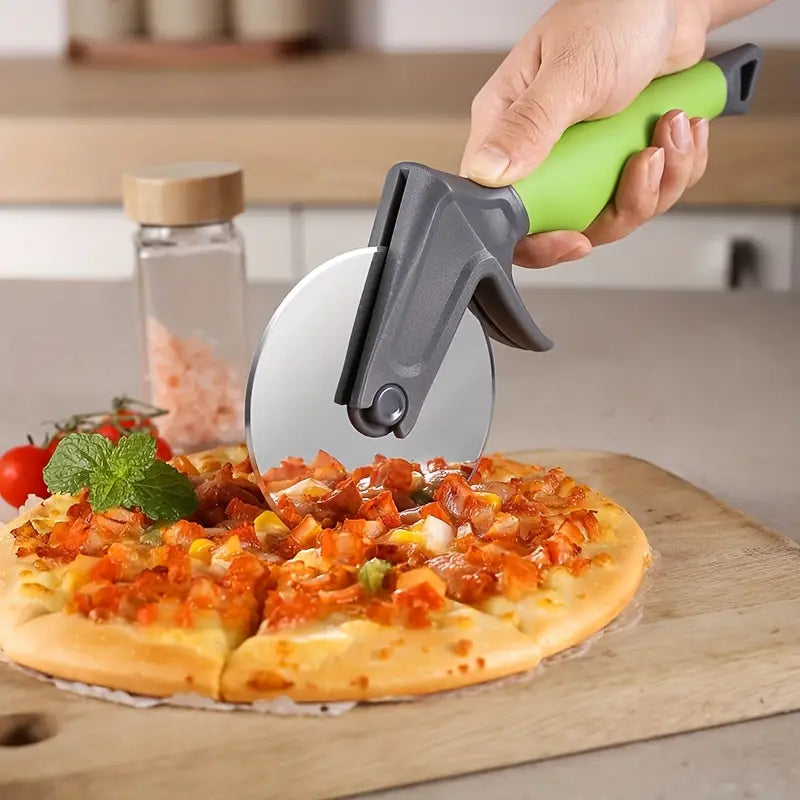 Person using a pizza cutter to slice a pizza on a wooden board with a kitchen background.